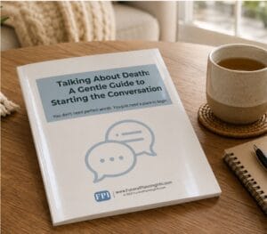 Talking About Death guide booklet on a table beside tea and notebook for starting end-of-life conversations.