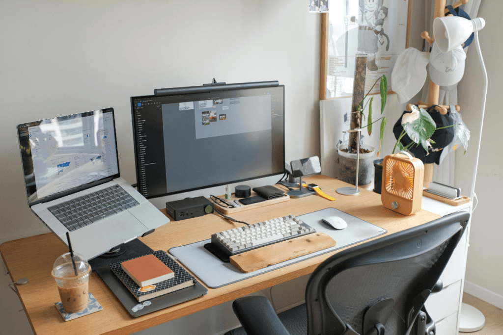 Home office with computers, phone and digital devices representing a person's digital afterlife.