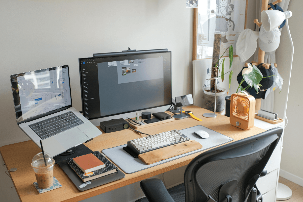 Home office with computers, phone and digital devices representing a person's digital afterlife.