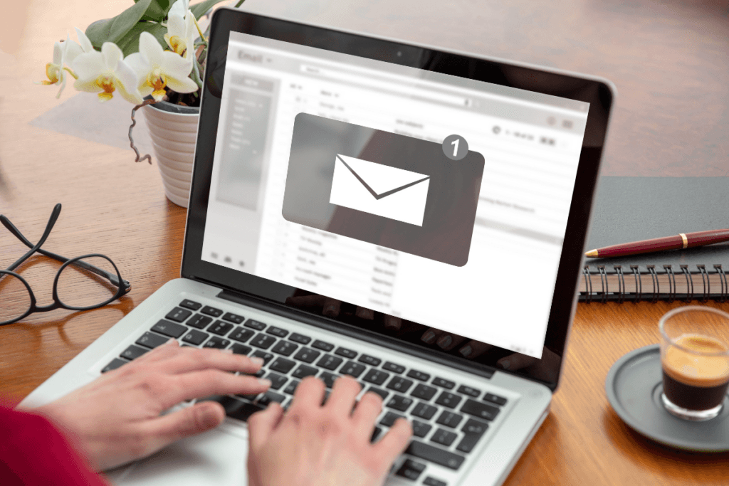  Person checking an email inbox on a laptop at home.